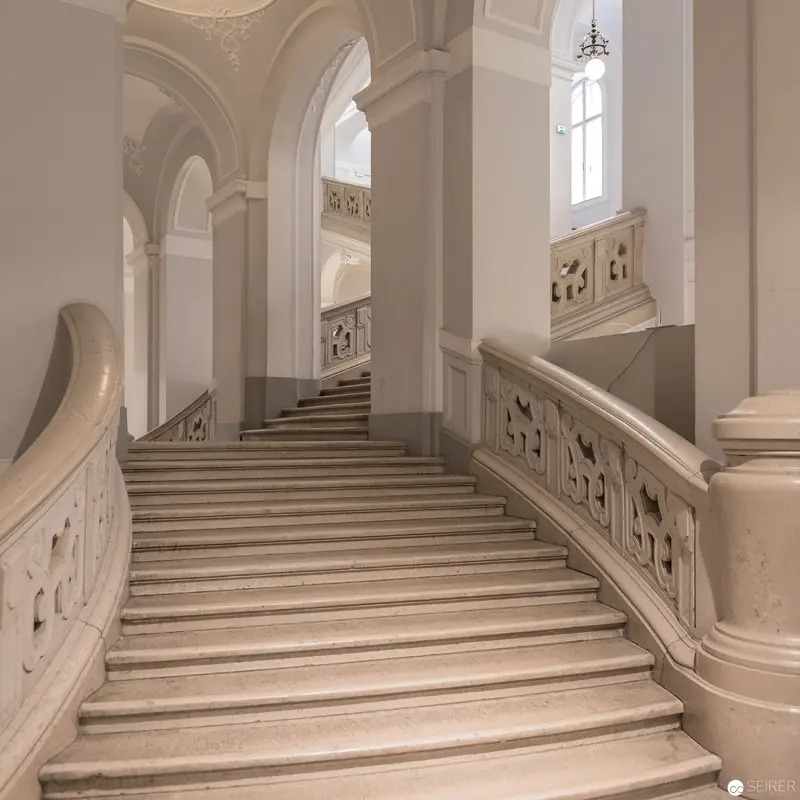 Grand Neoclassical Staircase with Ornate White Architectural Details