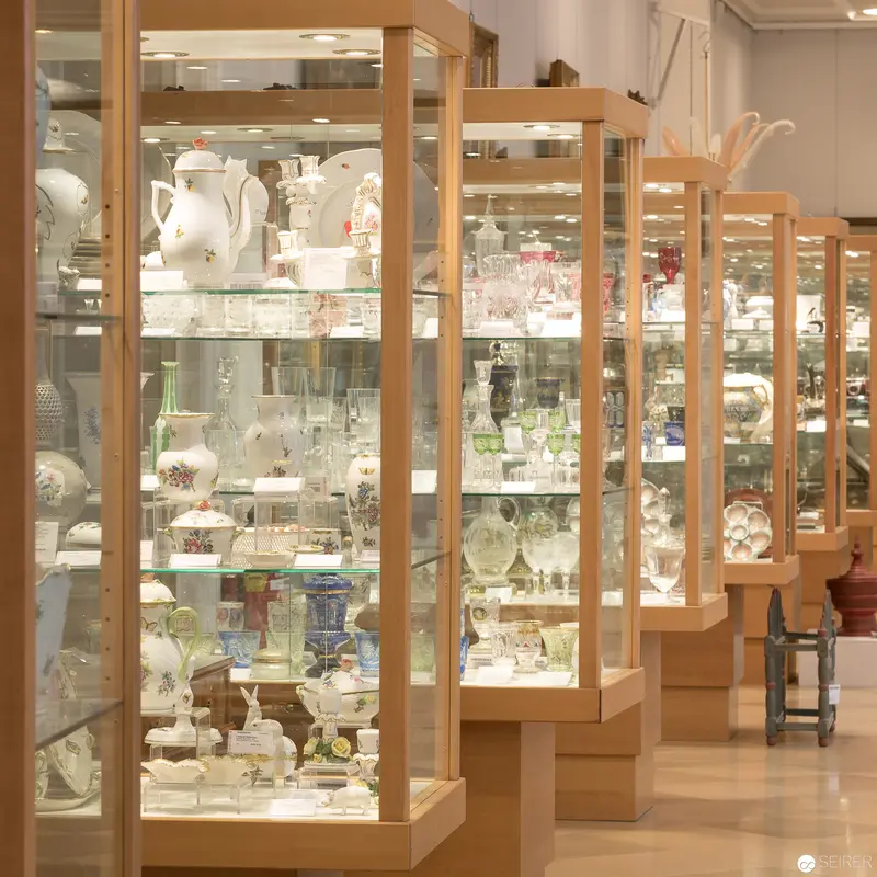 Museum Display Cases Exhibiting Delicate Glass and Ceramic Collections