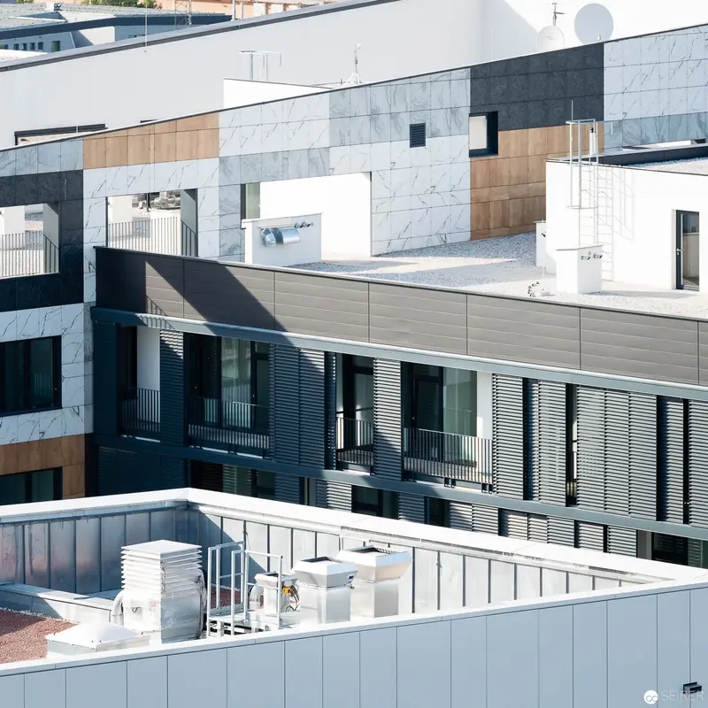 Architectural Layers: Modernist Urban Complex in Geometric Monochrome Composition
