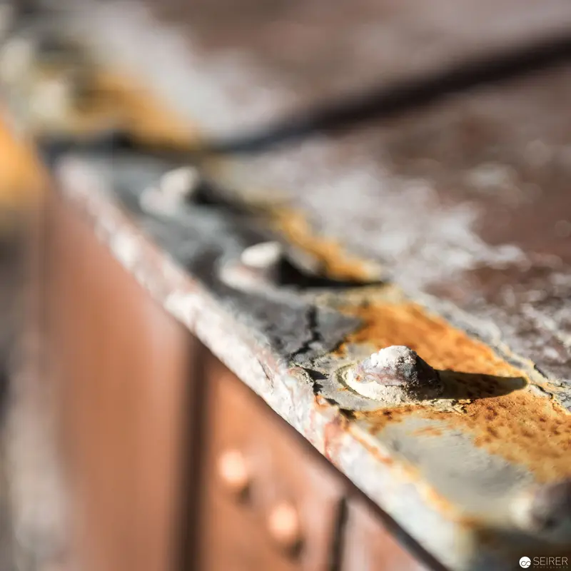 Oxidation and Decay: Rusted Metal Surface with Textural Erosion