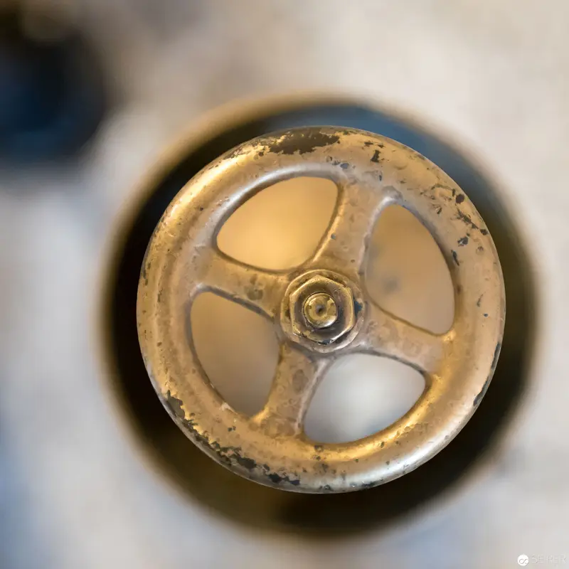Weathered Industrial Valve Wheel Photographed in Precise Macro Perspective