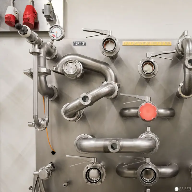 Industrial Machinery Conduits: Metallic Piping System with Valves and Pressure Indicators