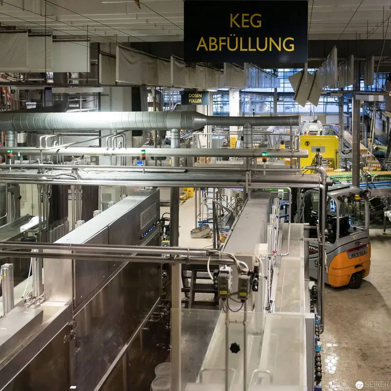Industrial Keg Filling Facility with Automated Machinery and Forklift