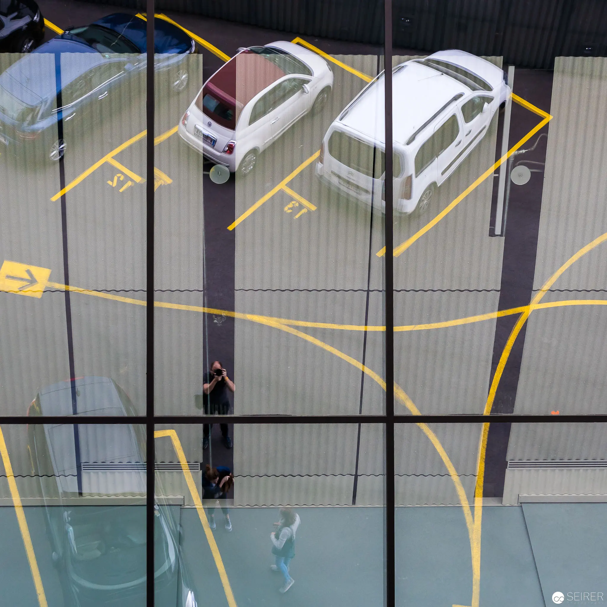 Urban Parking Grid: Geometric Aerial View of Vehicles and Pedestrian Pathways
