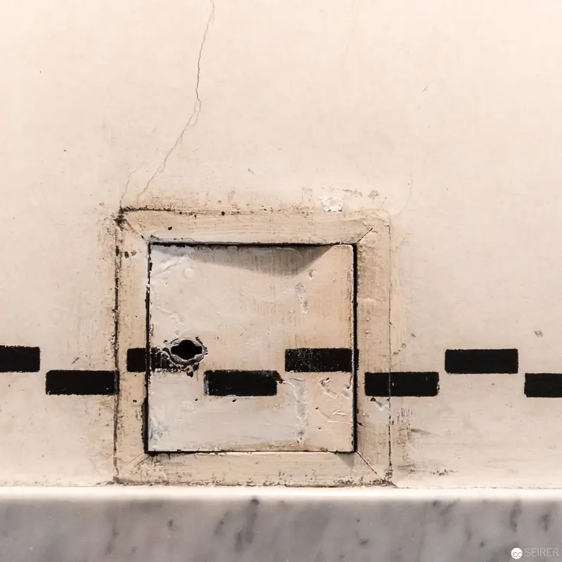 Abstract Architectural Fragment: Minimalist Wall Aperture with Geometric Interruptions