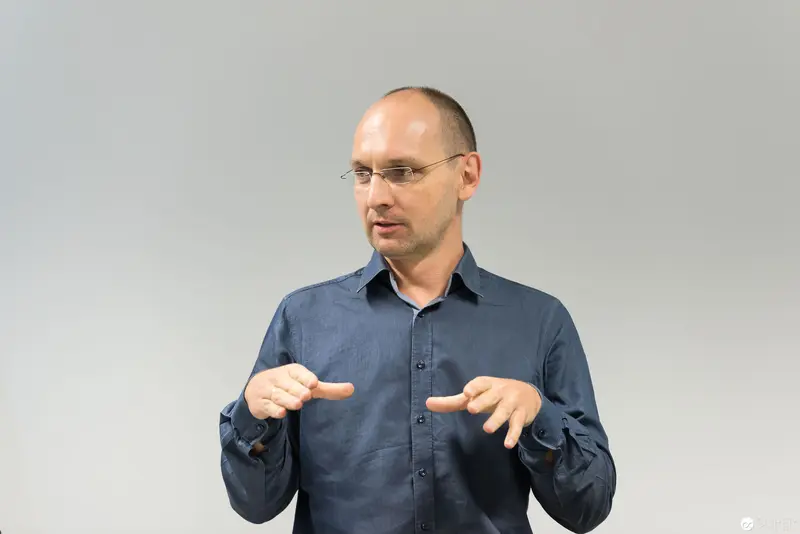 Microsoft User Group Meeting Speaker Demonstrates Explanatory Gesture