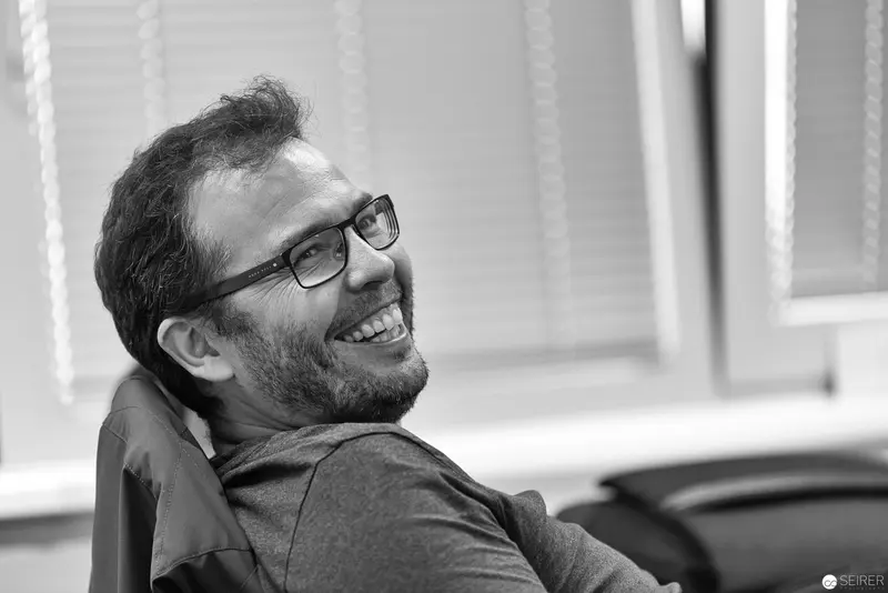 Microsoft User Group Meeting: Joyful Participant Laughing during Presentation