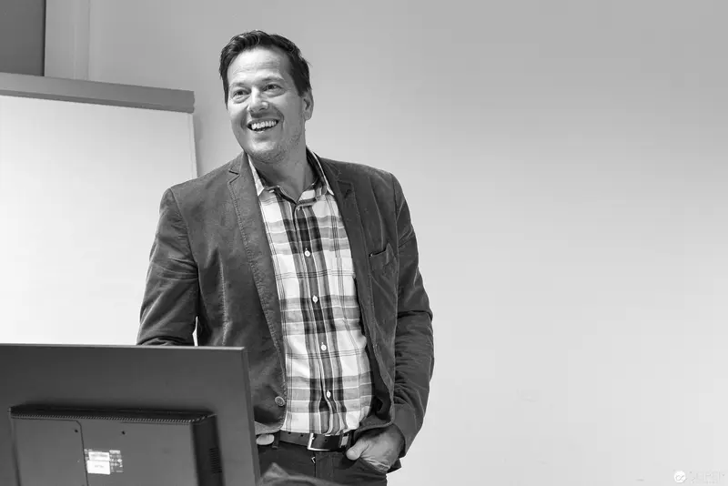 Smiling Professional at Microsoft User Group Meeting in Business Casual Attire