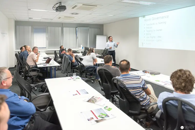 Microsoft User Group Meeting: Training Session with Presenter at Projection Screen