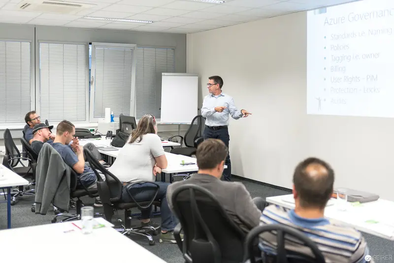 Microsoft User Group Meeting: Presenter Engaging Colleagues in Conference Room