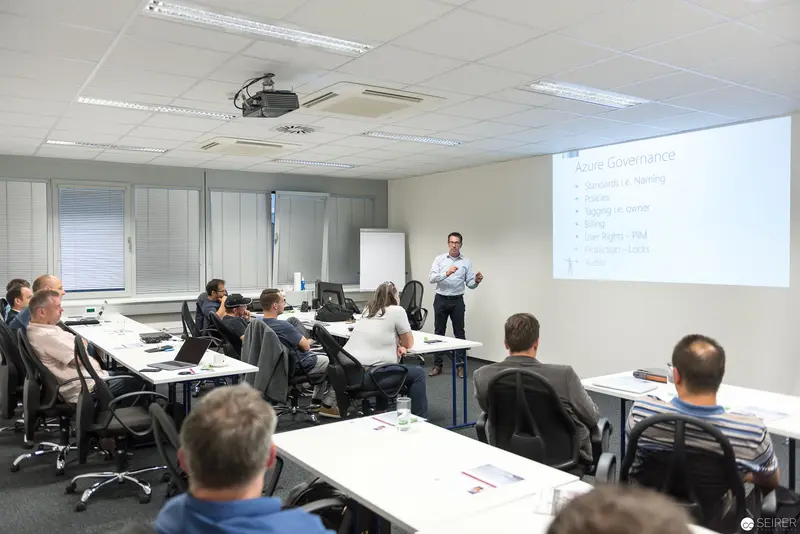 Microsoft User Group Meeting: Presenter Leads Technical Workshop in Corporate Training Room