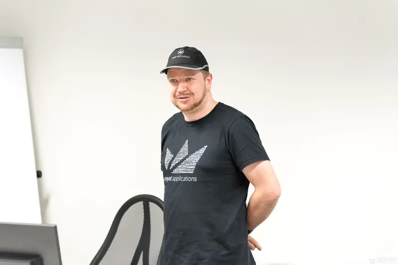 Microsoft User Group Meeting: Participant in Black Branded T-Shirt and Cap