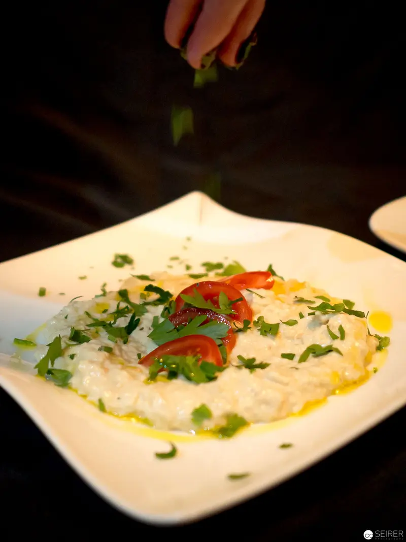Delicate Risotto Plating with Fresh Herbs at Benjaminis Restaurant, Vienna