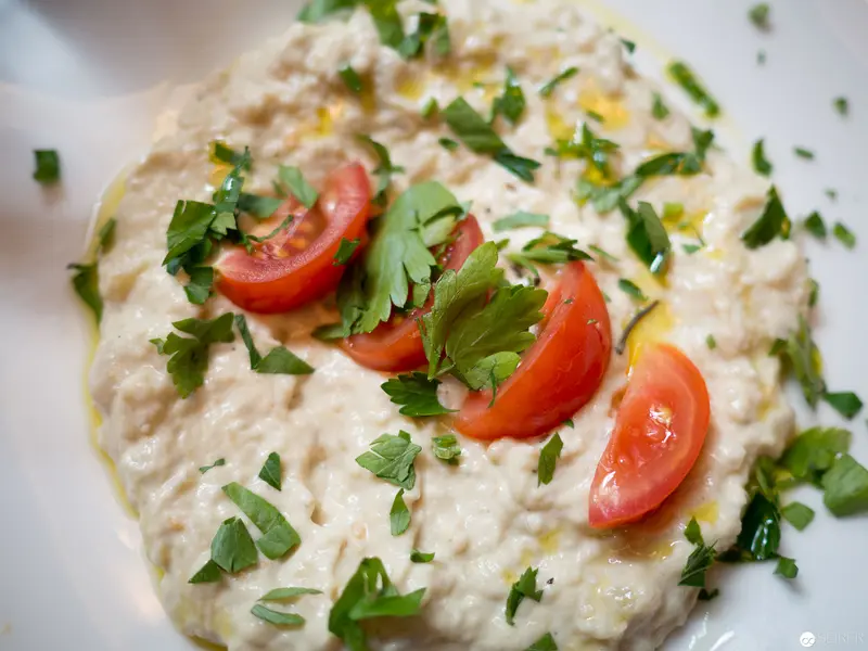 Creamy Levantine Dip with Vine Tomatoes and Fresh Parsley Garnish
