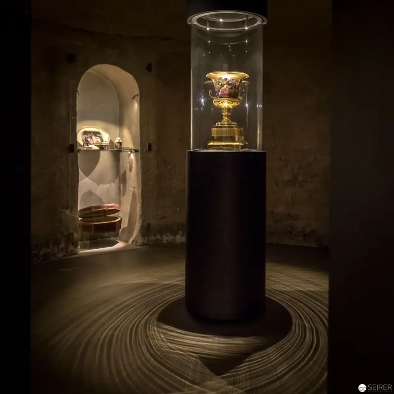Ornate Ceremonial Chalice Displayed in Dramatic Museum Illumination