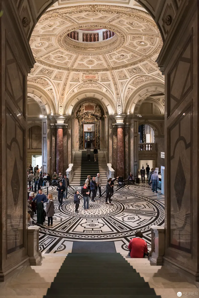 Ornate Museum Interior with Elaborate Dome and Intricate Mosaic Flooring
