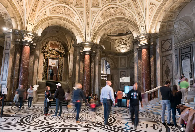 Ornate Interior with Marble Columns and Intricate Floor at Historical Venue