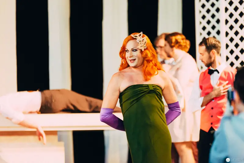 Vibrant Performer in Green Dress at Nesterval's "Dirty Faust" Theatre Production