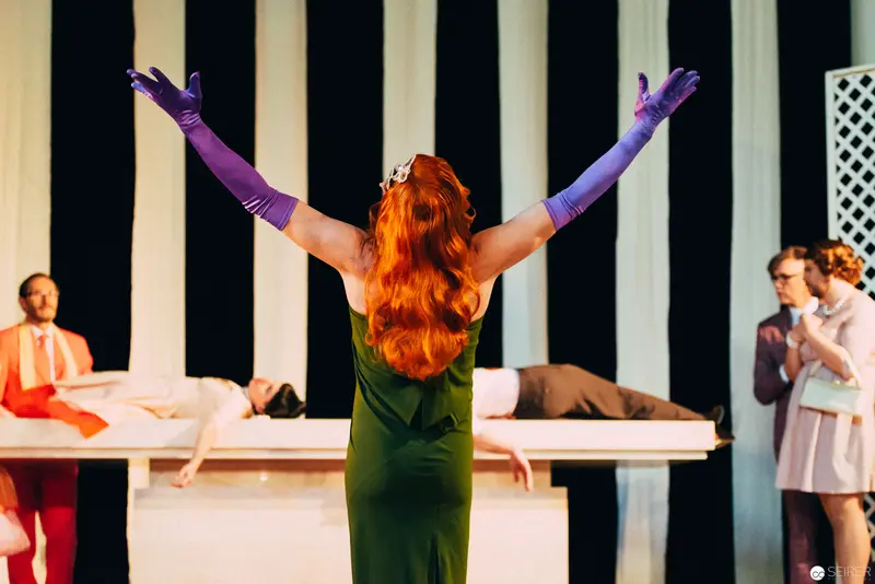 Nesterval's "Dirty Faust": Dramatic Performance with Raised Purple-Gloved Arms