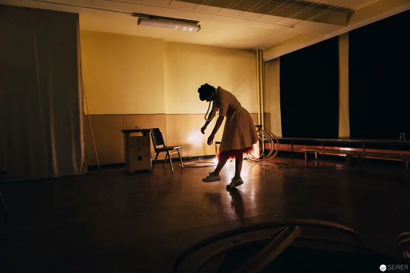 Silhouetted Performer in Dramatic Lighting During Nesterval's "Dirty Faust" Performance