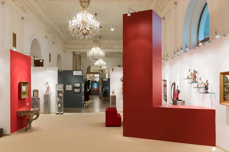 Red Architectural Intervention in Ornate Viennese Exhibition Space