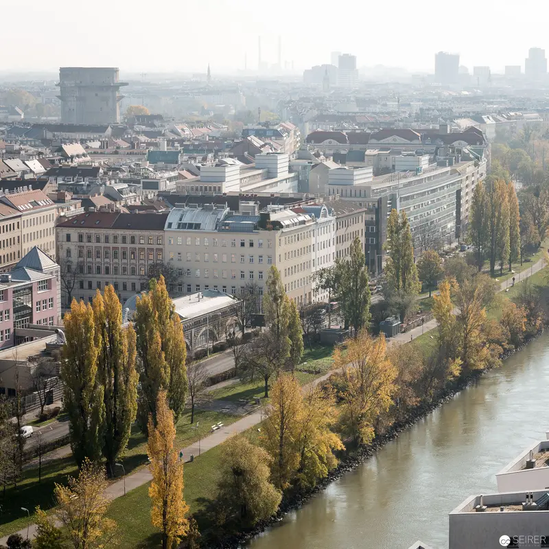 Vienna's Urban Landscape with Spittelau Riverfront and Autumn Poplar Trees