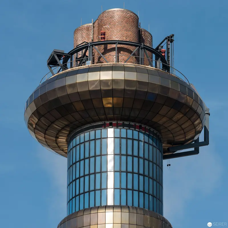Spittelau Waste Incineration Plant's Distinctive Architectural Tower Against Blue Sky