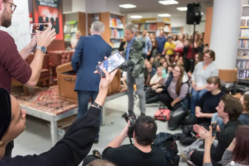 Thomas Brezina Book Presentation at Kuppitsch Bookstore, Audience Capturing Event Moment
