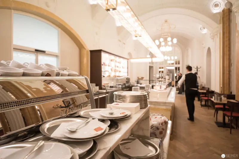 Café Interior with Elegant White Porcelain and Arched Architectural Spaces