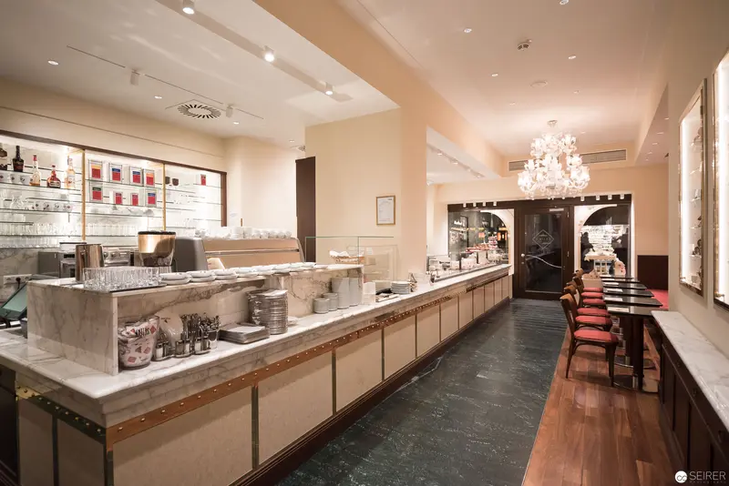 Modern Cafe Interior with Marble Counter and Chandelier Elegance