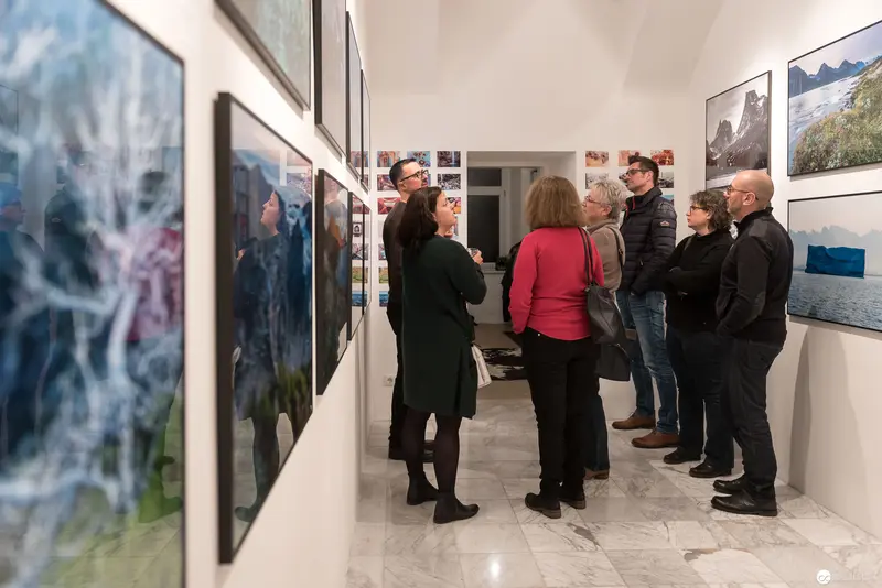 Wolf Hoffmann Vernissage: Viewers Examining Photographic Landscape Compositions in Gallery Space