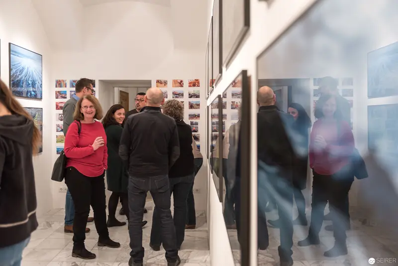 Wolf Hoffmann Vernissage: Gallery Visitors Exploring Photographic Exhibition Space