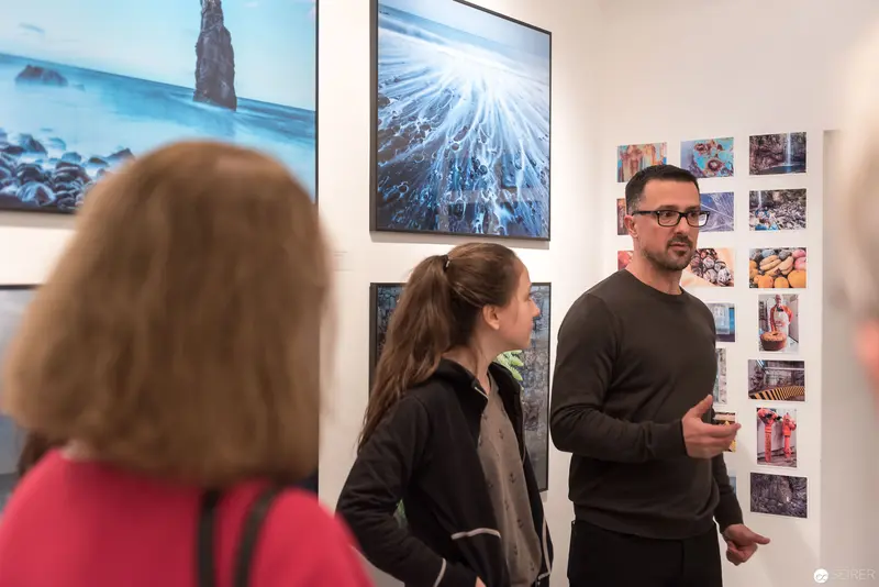 Wolf Hoffmann's Photographic Exhibition: Curator Discussing Landscape and Archival Works