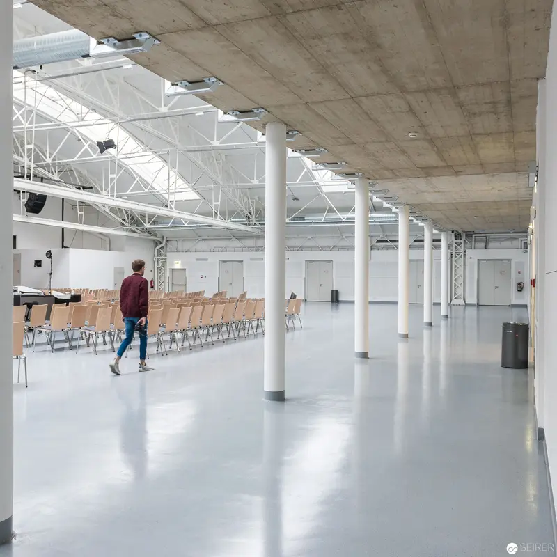 Solitary Figure in Expansive Industrial Hall: Anker Brotfabrik, Vienna 2017
