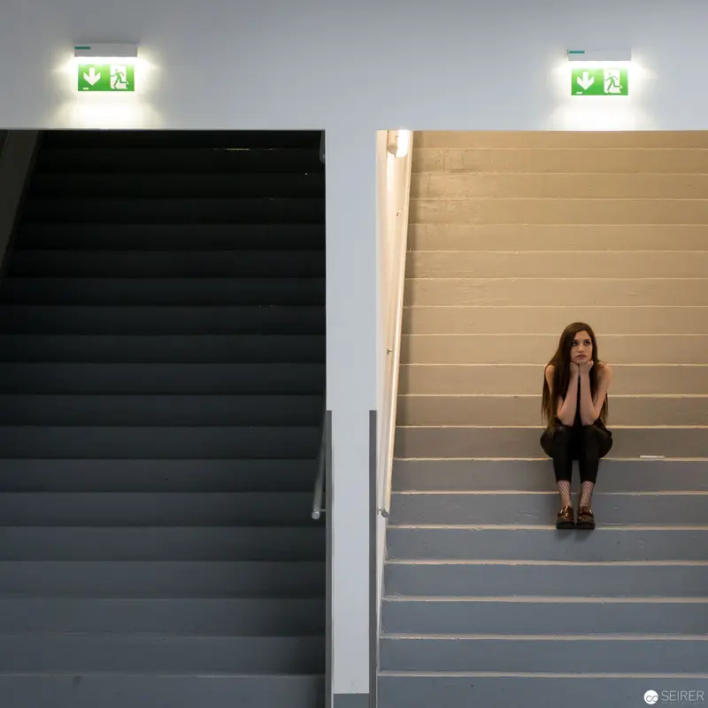 Solitary Figure on Stark Staircase: Architecture Photography at Expedithalle Anker Brotfabrik, Vienna 2017