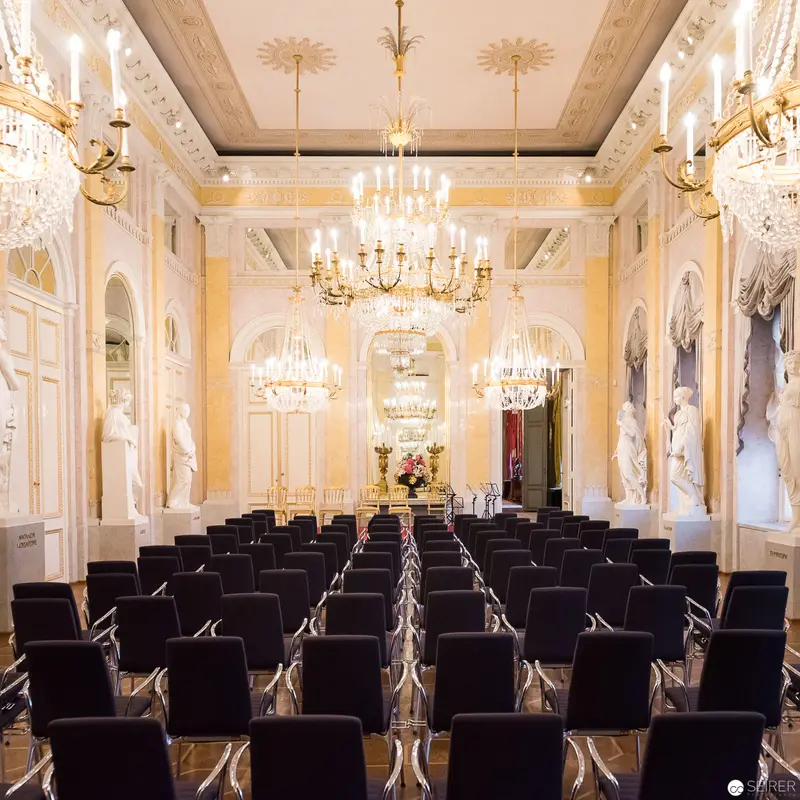 Ornate Baroque Hall Prepared for Ceremonial Conference with Crystal Chandeliers