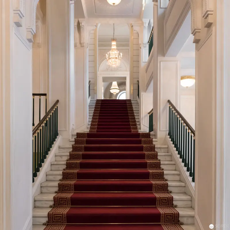 Grand Marble Staircase with Red Runner in Neoclassical Interior Architecture