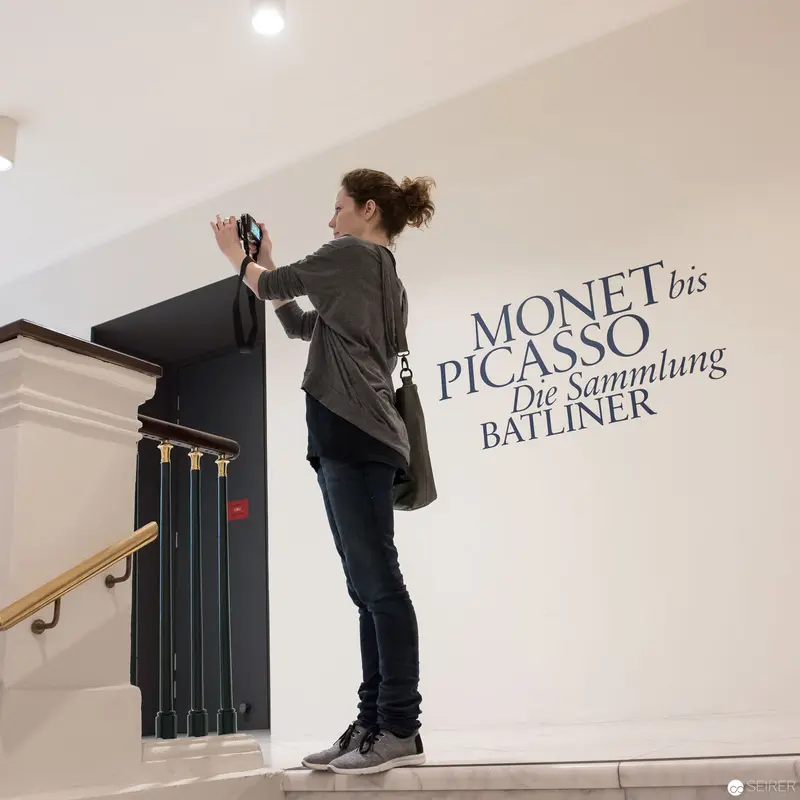 Gallery Visitor Photographing Monet to Picasso Exhibition Wall Text