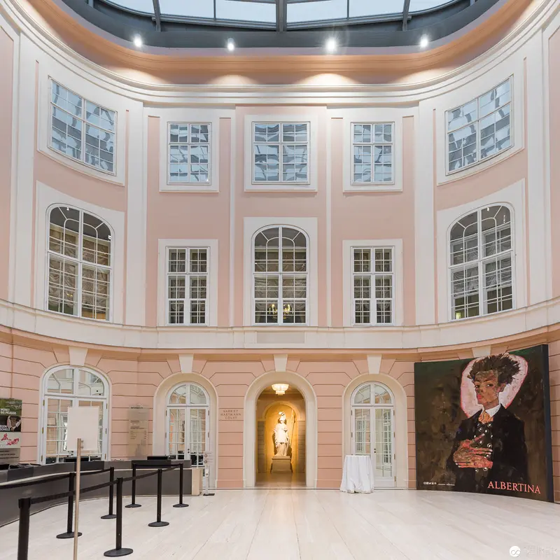 Albertina Museum Interior with Exhibition Portrait and Arched Windows