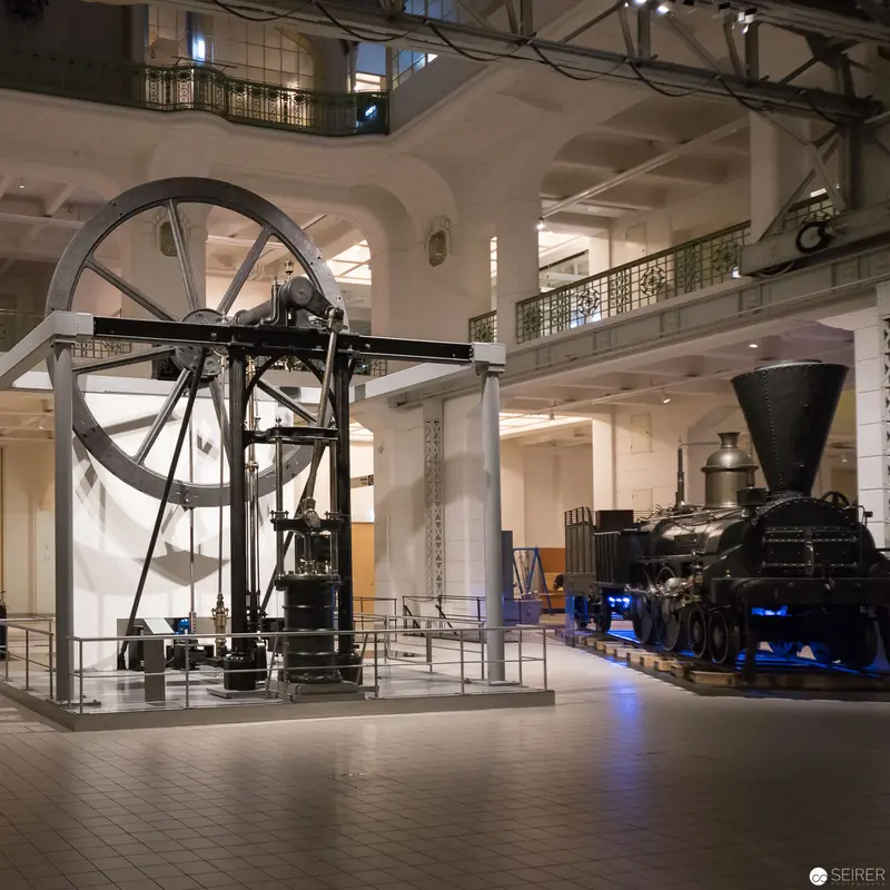 Industrial Heritage Museum Interior with Vintage Machinery and Steam Locomotive