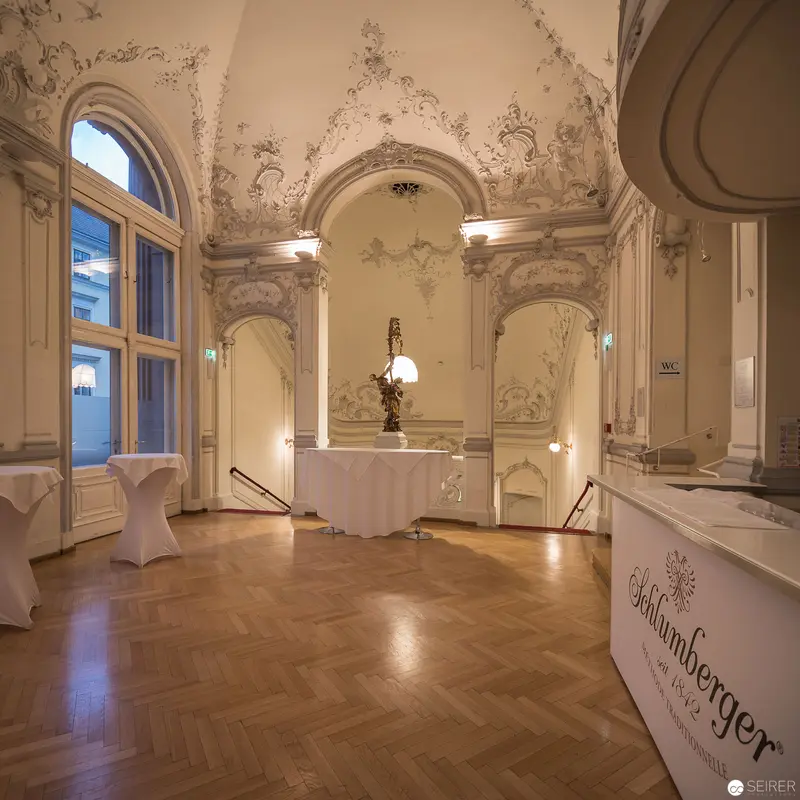 Ornate Ballroom Interior with Baroque Architectural Details and Parquet Flooring