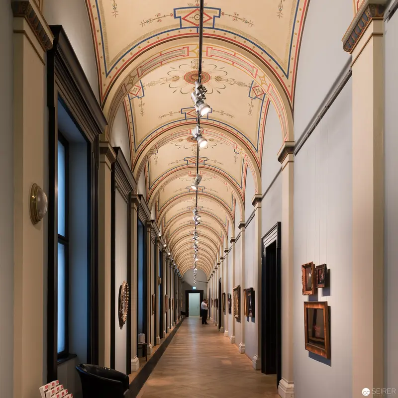 Ornate Museum Corridor with Arched Ceiling and Art Gallery Lighting