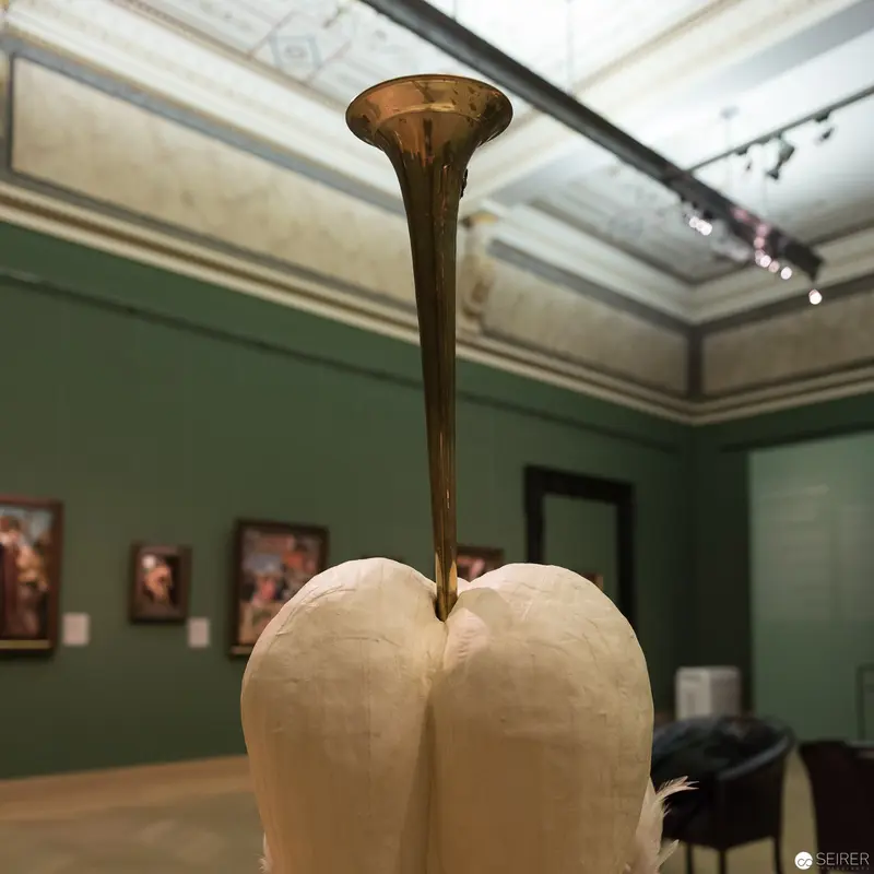 Anatomical Sculpture with Bronze Instrument in Museum Gallery Setting