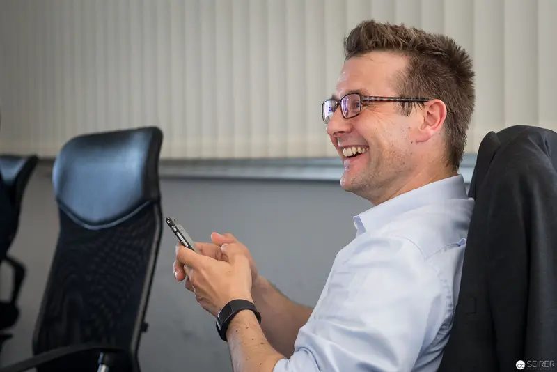 Experts Live Usergroup Member Laughing During Microsoft Technologies Discussion in Linz