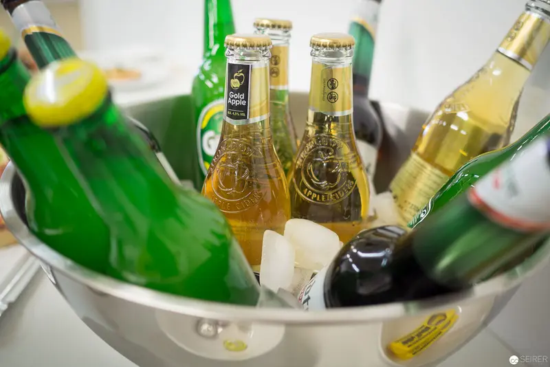 Chilled Beverage Collection in Metallic Ice Bucket with Varied Bottled Drinks