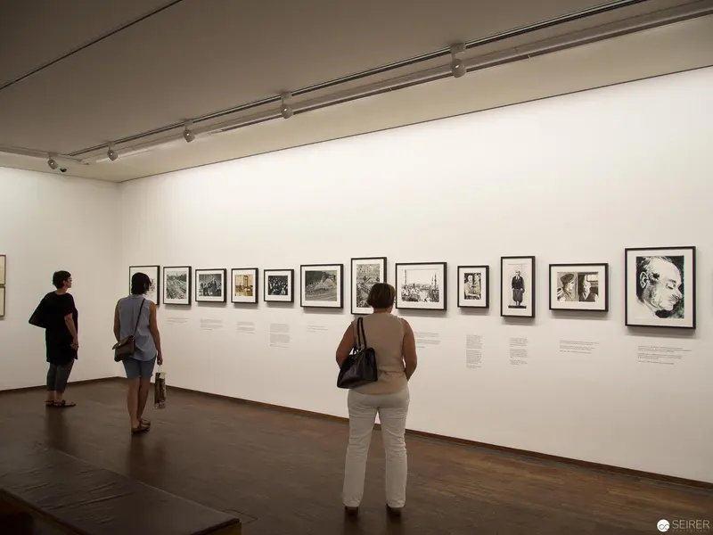 Contemplative Viewers at Albertina's "New Acquisitions" Photographic Exhibition