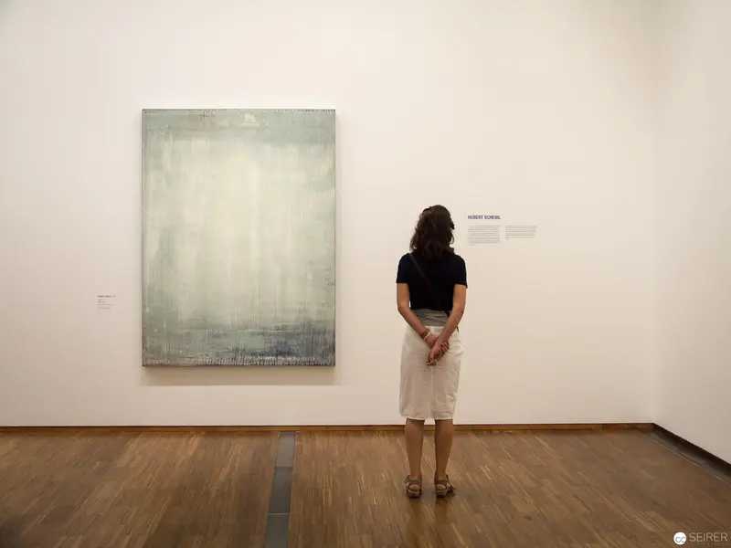 Solitary Viewer Contemplates Minimalist Artwork at Albertina's New Acquisitions Exhibition