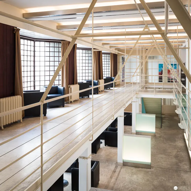 Architectural Interior with Exposed Wood Framing and Multi-Level Spatial Configuration