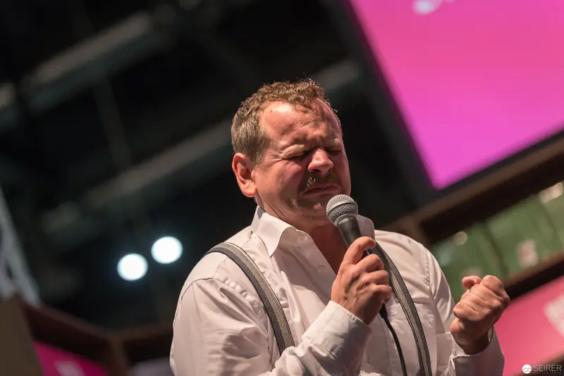 Passionate Performer Singing with Intensity at Live Event