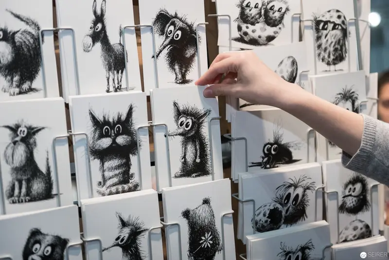 Whimsical Black and White Creature Illustrations Displayed at Book Fair